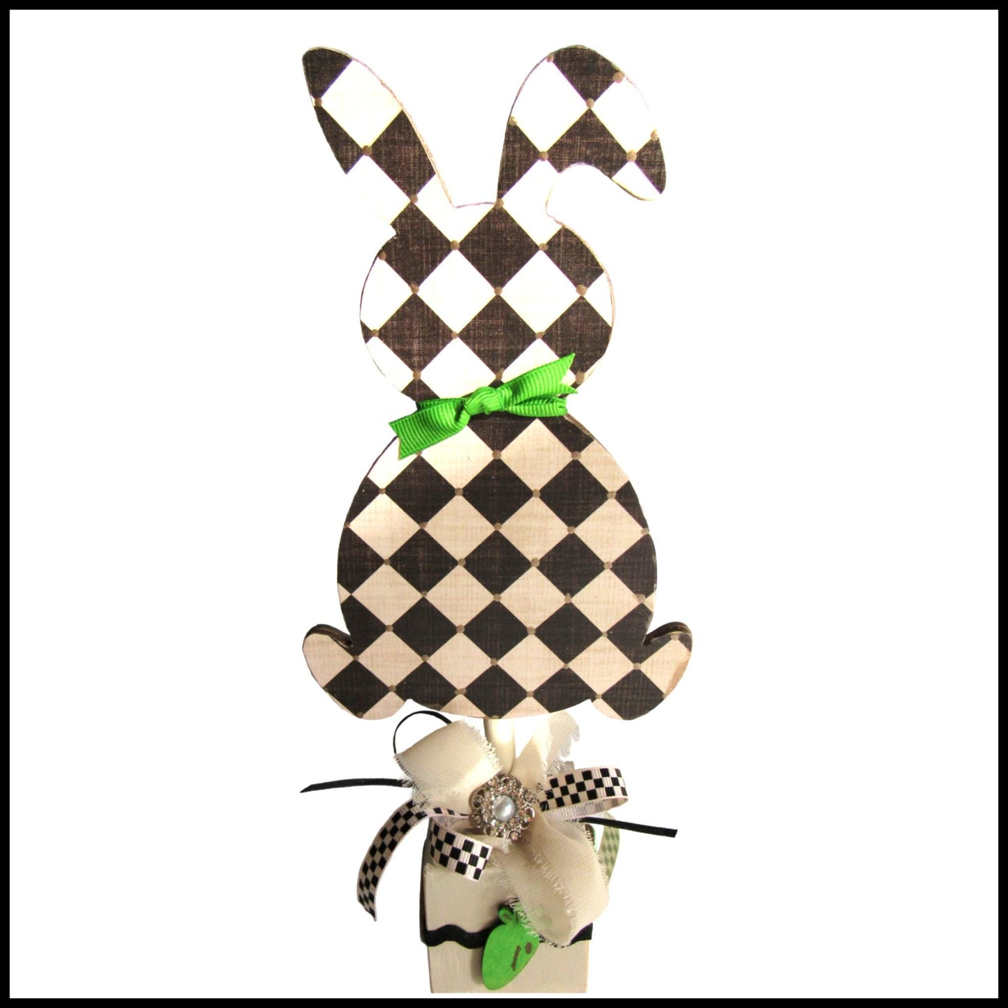 Black and off white checkered handmade wood bunny or egg home decor on a stand