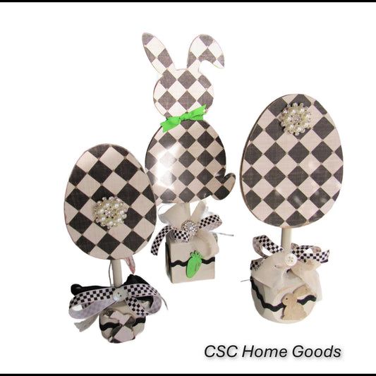Black and off white checkered handmade wood bunny or egg home decor on a stand