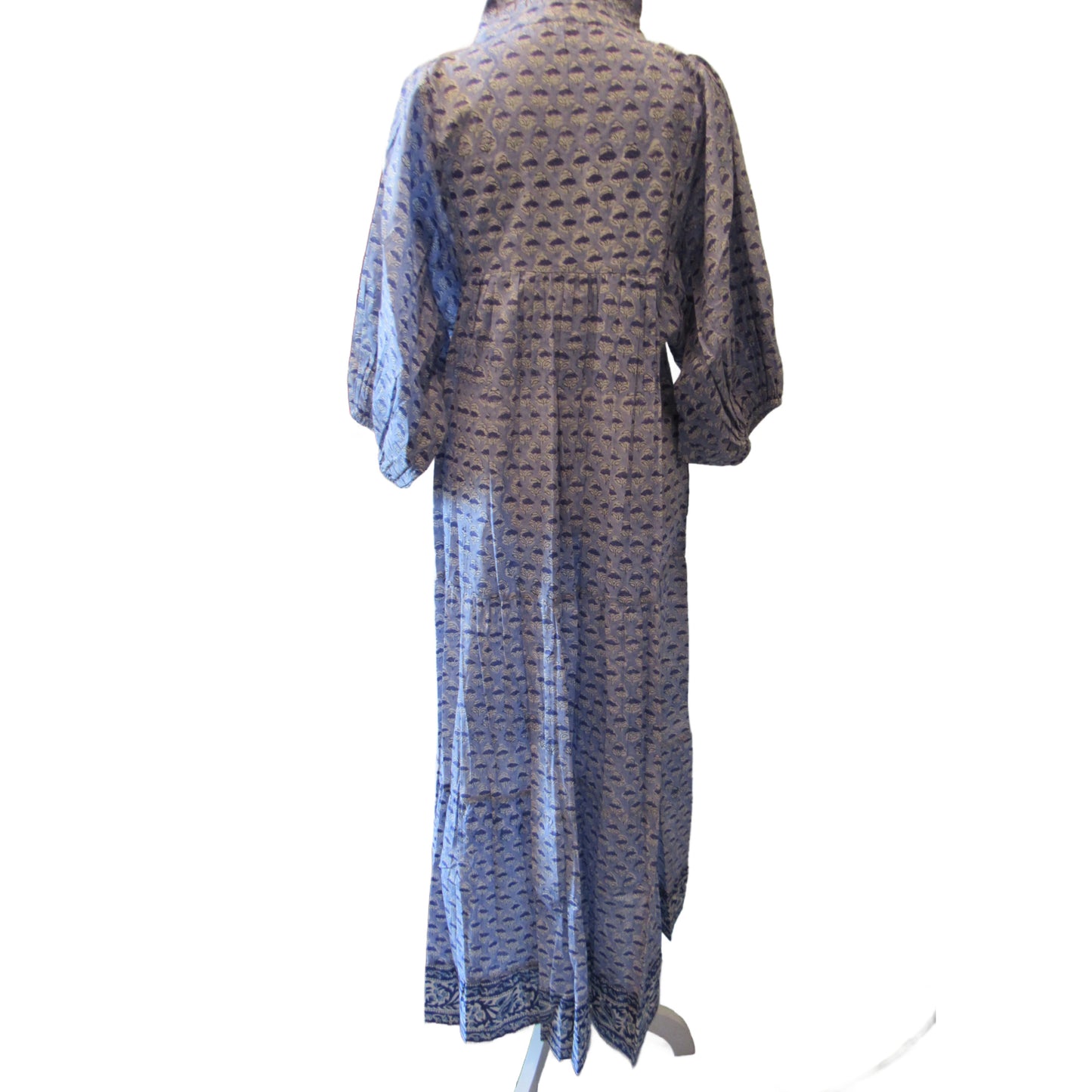 Back view of blue floral block print dress on mannequin