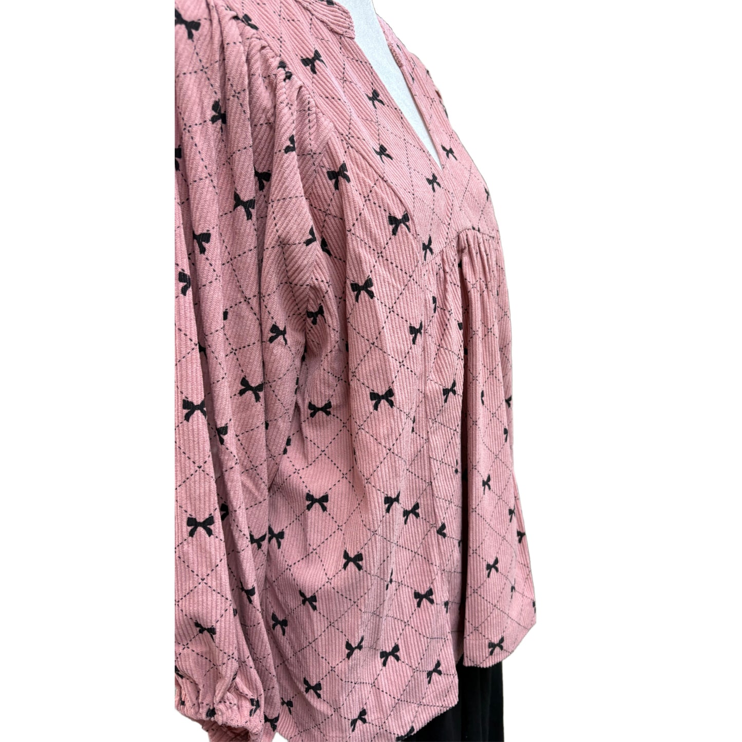 Long sleeve pink and black top with bow design