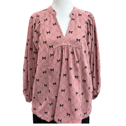 Long sleeve pink and black top with bow design