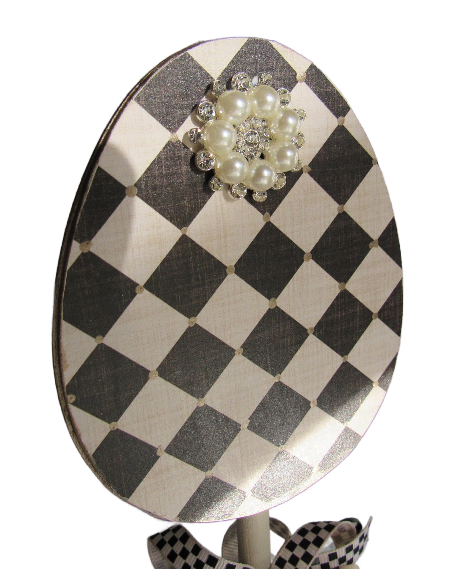 Black and off white checkered handmade wood bunny or egg home decor on a stand