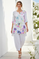 Lifestyle photo - model wearing watercolor floral linen two-piece set